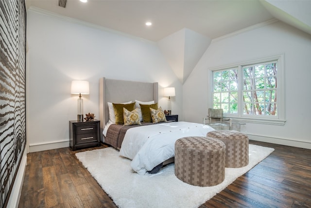 bedroom with vaulted ceiling, dark hardwood / wood-style flooring, and ornamental molding