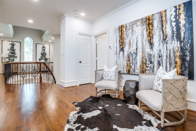 living area with dark wood-type flooring and crown molding