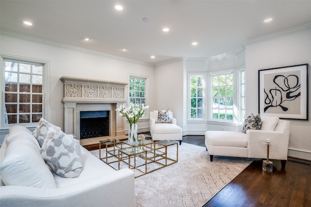 living room with ornamental molding and hardwood / wood-style flooring