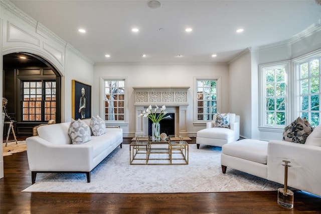 living room with ornamental molding and wood-type flooring