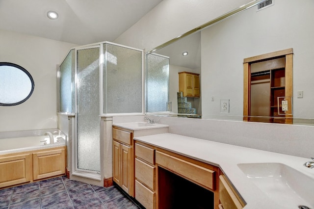 bathroom featuring shower with separate bathtub, vanity, and tile flooring