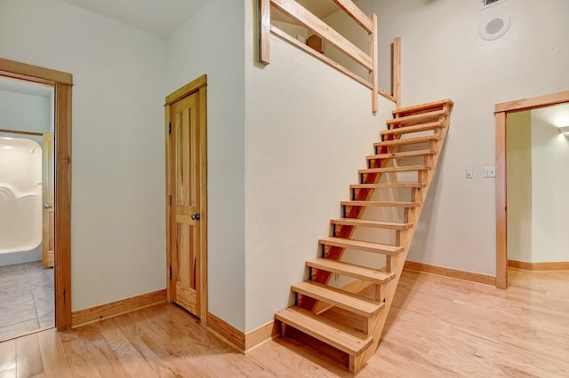 stairway with light tile flooring