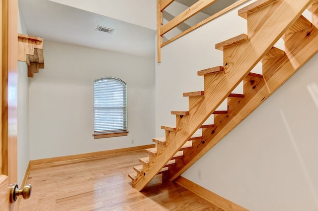 staircase featuring light hardwood / wood-style flooring