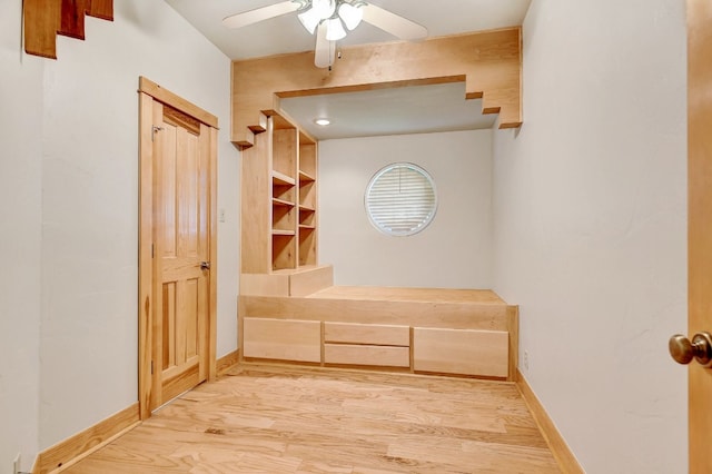 bathroom featuring ceiling fan and wood-type flooring