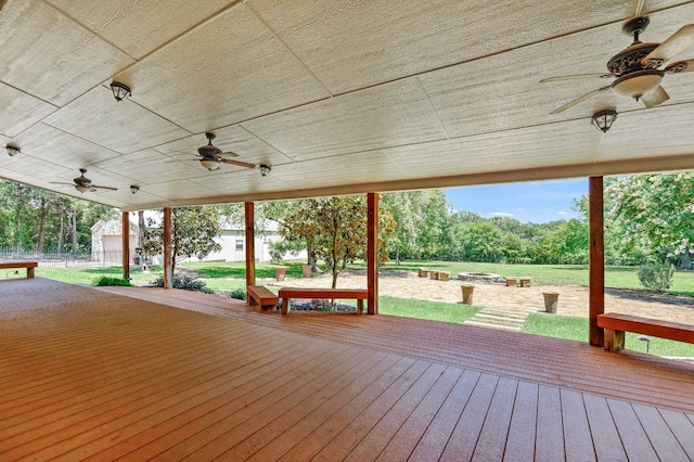 wooden terrace featuring ceiling fan