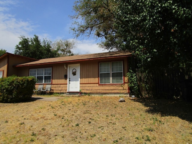 ranch-style house with a front lawn