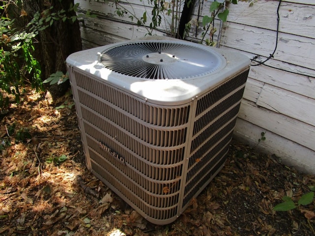 details with a hot tub and central AC unit