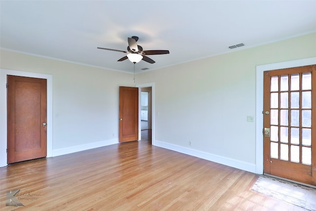 empty room with light hardwood / wood-style floors and ceiling fan