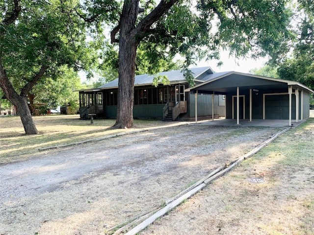 ranch-style house featuring a carport