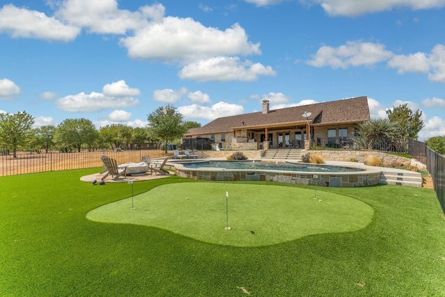 exterior space with a swimming pool and a patio area