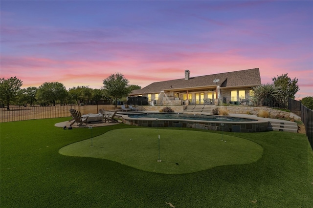 exterior space featuring a patio area and a fenced in pool