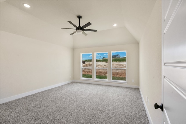 empty room with carpet, vaulted ceiling, and ceiling fan