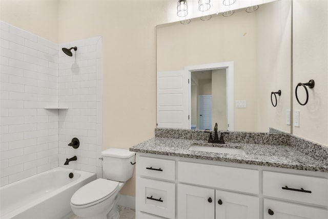 full bathroom featuring toilet, vanity, and tiled shower / bath