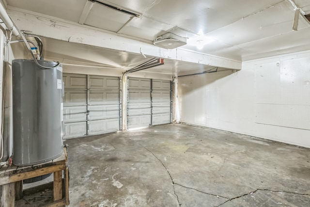 garage with electric water heater and a garage door opener