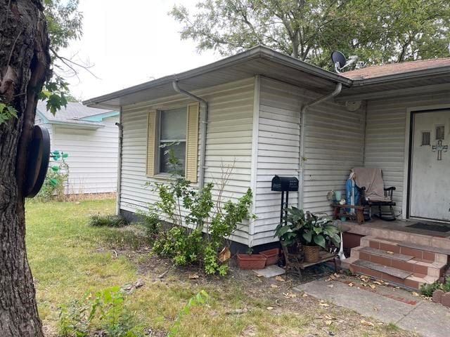 view of home's exterior featuring a yard