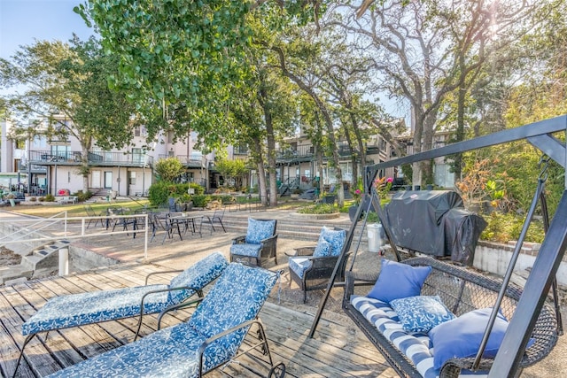 deck featuring a grill and an outdoor living space