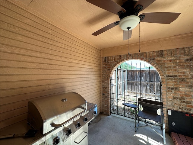 view of patio with grilling area and ceiling fan