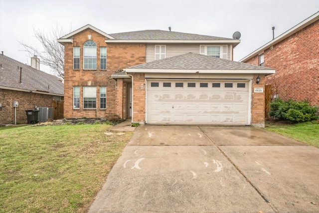 view of property featuring a garage, central AC, and a front lawn