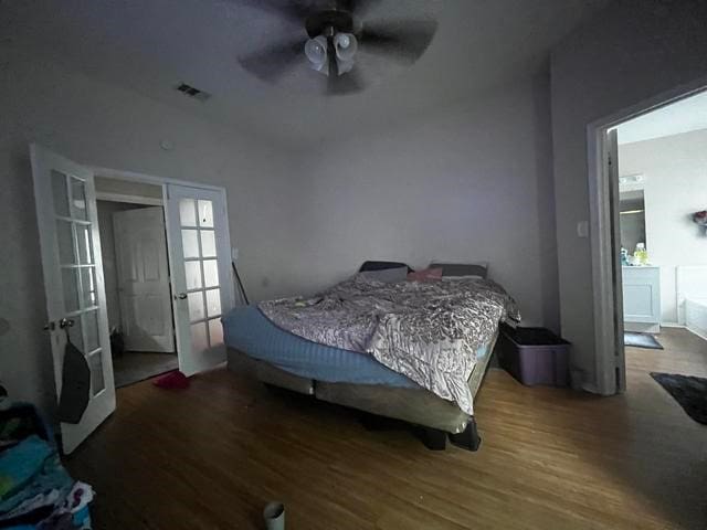 bedroom featuring french doors, ceiling fan, lofted ceiling, and dark wood-type flooring