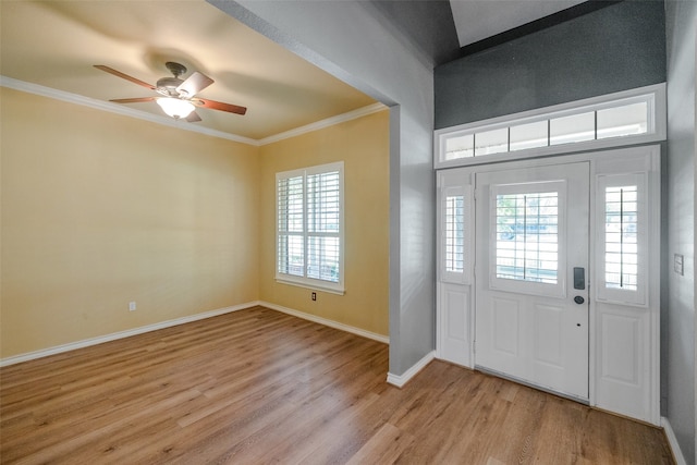 entrance foyer featuring light hardwood / wood-style flooring, ceiling fan, and a wealth of natural light