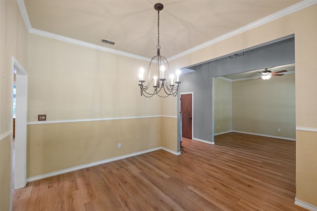 empty room featuring ceiling fan with notable chandelier, ornamental molding, and hardwood / wood-style floors