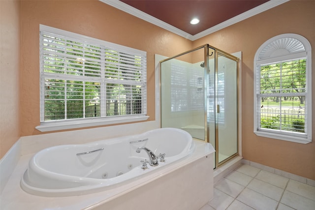 bathroom with a healthy amount of sunlight, shower with separate bathtub, and tile floors