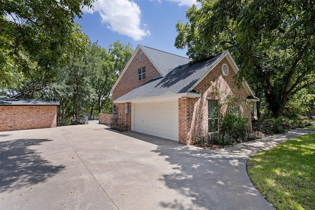 view of side of property with a garage