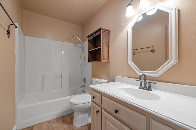 full bathroom featuring hardwood / wood-style flooring,  shower combination, vanity, and toilet