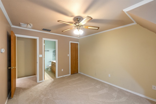 unfurnished bedroom with ornamental molding, carpet flooring, ceiling fan, and ensuite bathroom