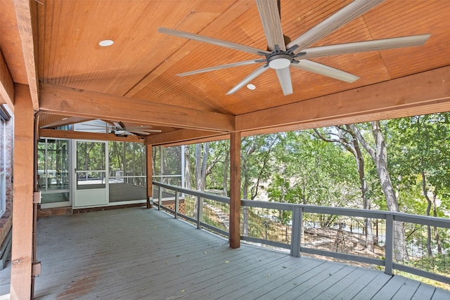 wooden deck featuring ceiling fan