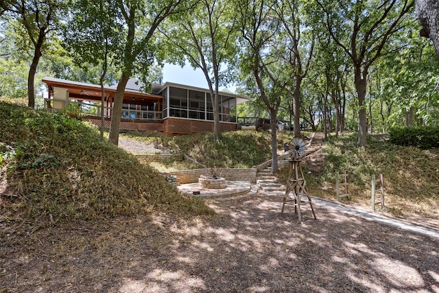 view of yard with a sunroom