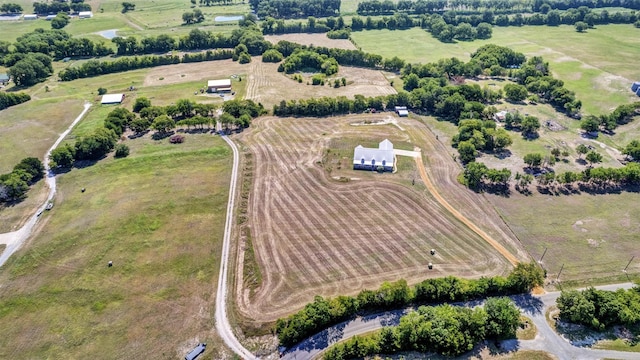 birds eye view of property with a rural view