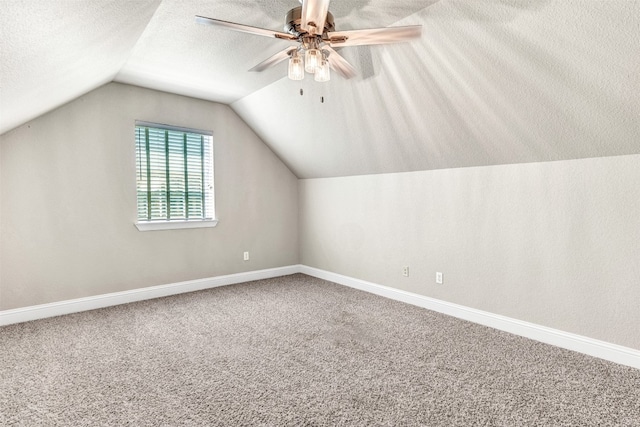 bonus room featuring ceiling fan, carpet, and vaulted ceiling