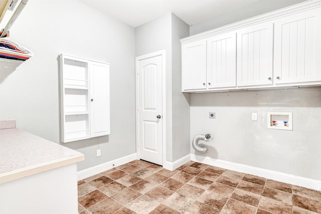 laundry room featuring washer hookup, hookup for an electric dryer, and cabinets