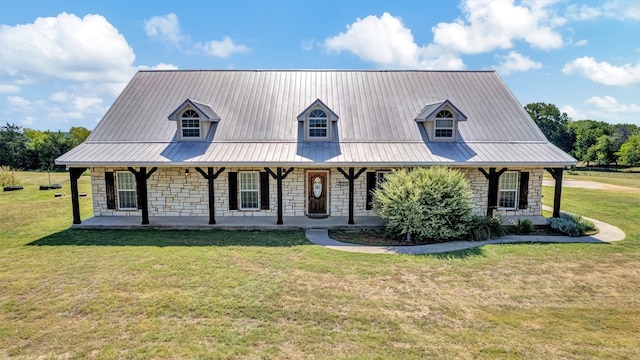 view of front of house with covered porch and a front yard