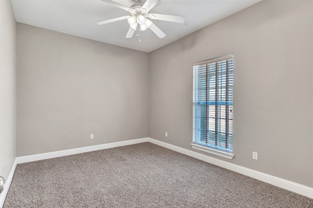 carpeted empty room featuring ceiling fan