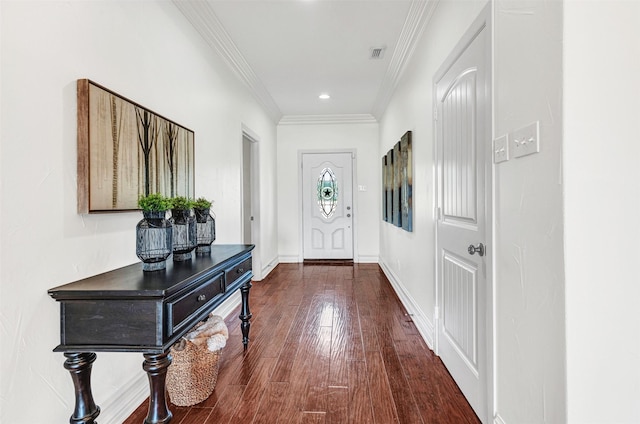 foyer with dark wood-type flooring and ornamental molding