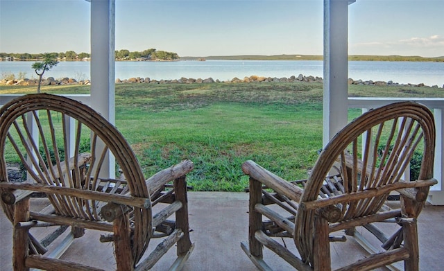 view of patio with a water view