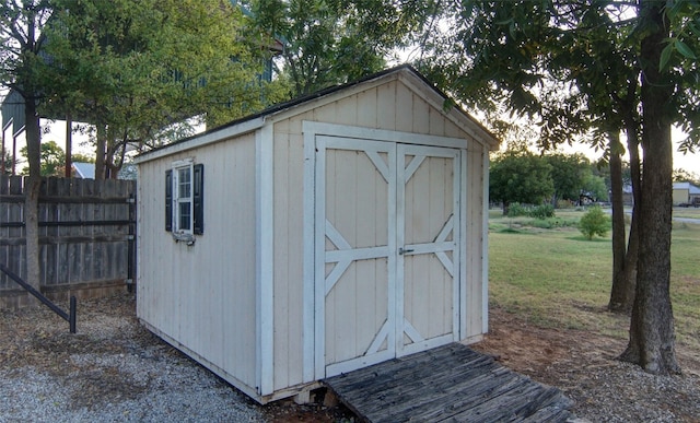 view of outdoor structure featuring a lawn