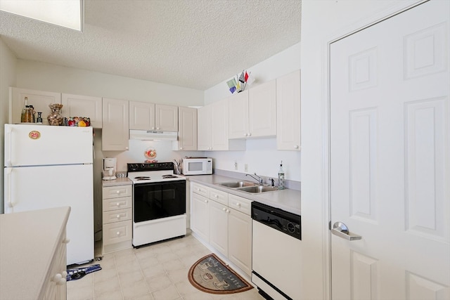 kitchen featuring light tile flooring, white appliances, a textured ceiling, sink, and white cabinetry