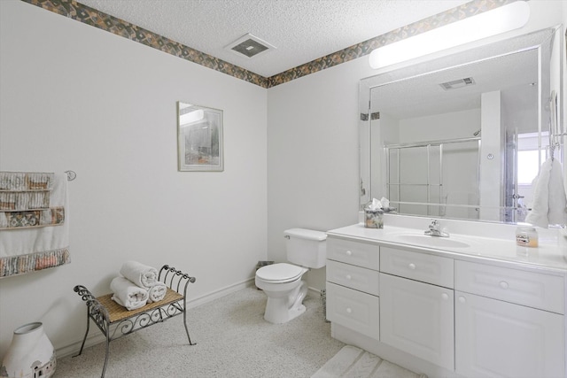 bathroom with toilet, a textured ceiling, and oversized vanity