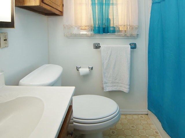 bathroom with vanity and toilet