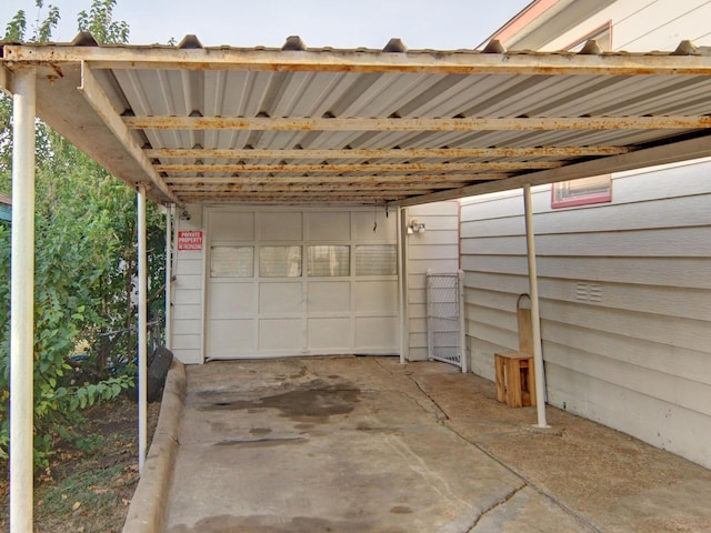 garage featuring a carport