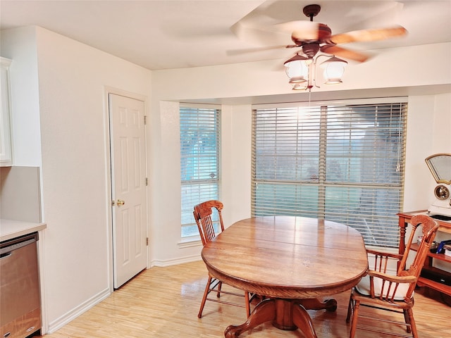 dining space featuring ceiling fan and light wood-type flooring