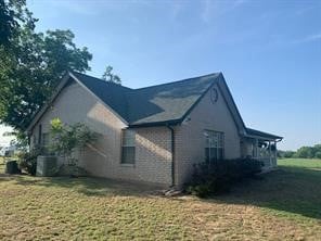 view of home's exterior featuring a yard