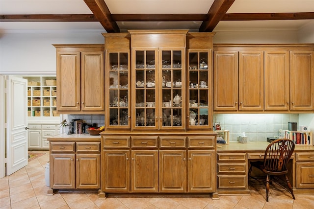 kitchen featuring coffered ceiling, backsplash, and light tile floors