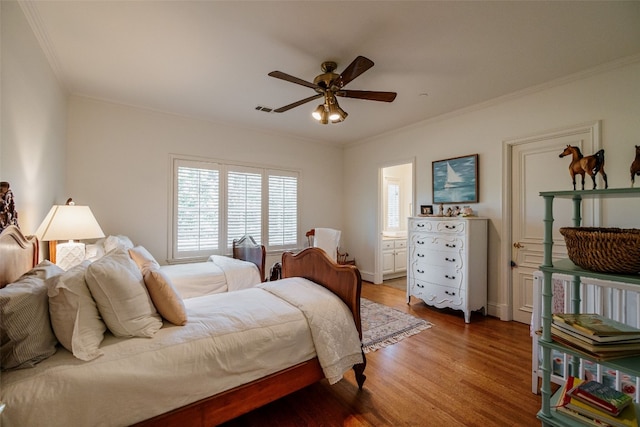 bedroom with ceiling fan, crown molding, and hardwood / wood-style flooring