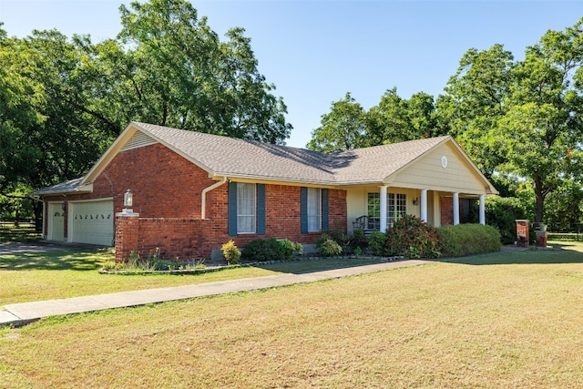 ranch-style house with covered porch, a front lawn, and a garage