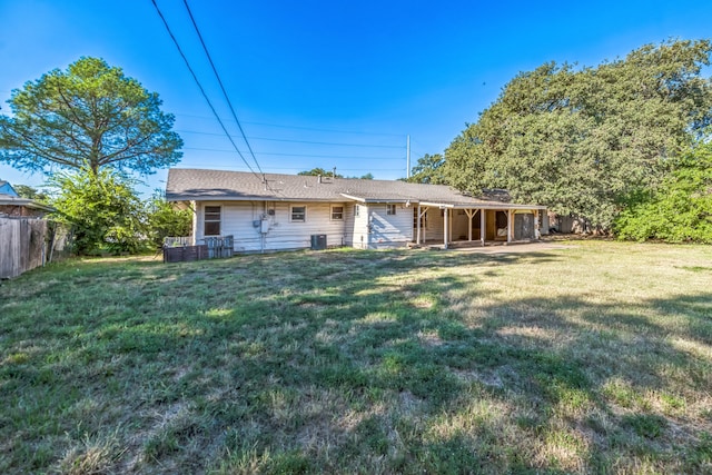 back of house featuring a yard