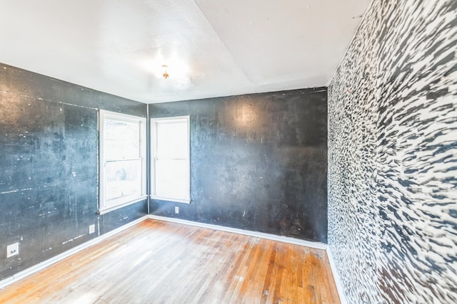 spare room featuring hardwood / wood-style flooring